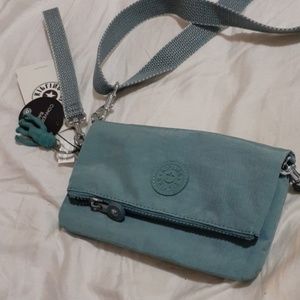 An aqua Kipling small bag
